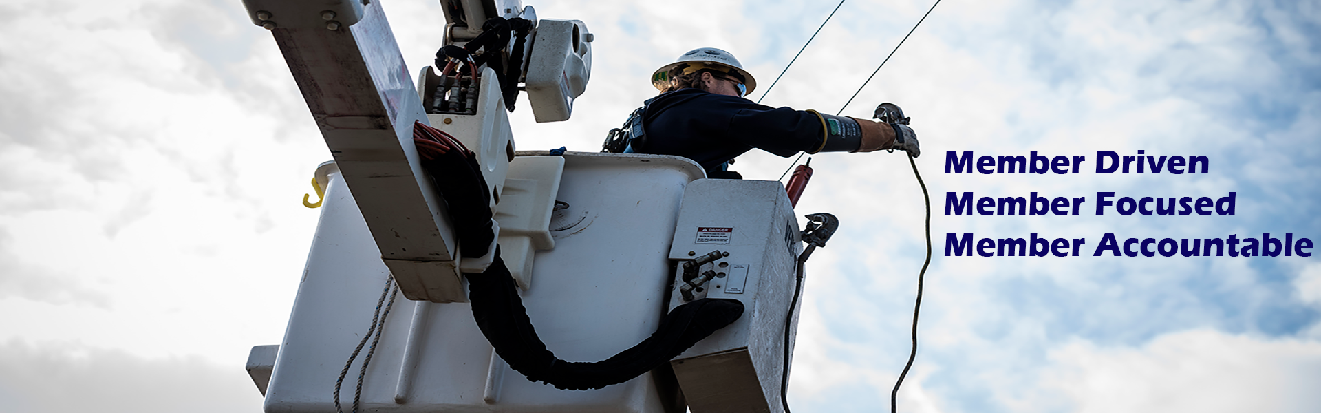 Slide of a lineman in a utility truck bucket working on a power line