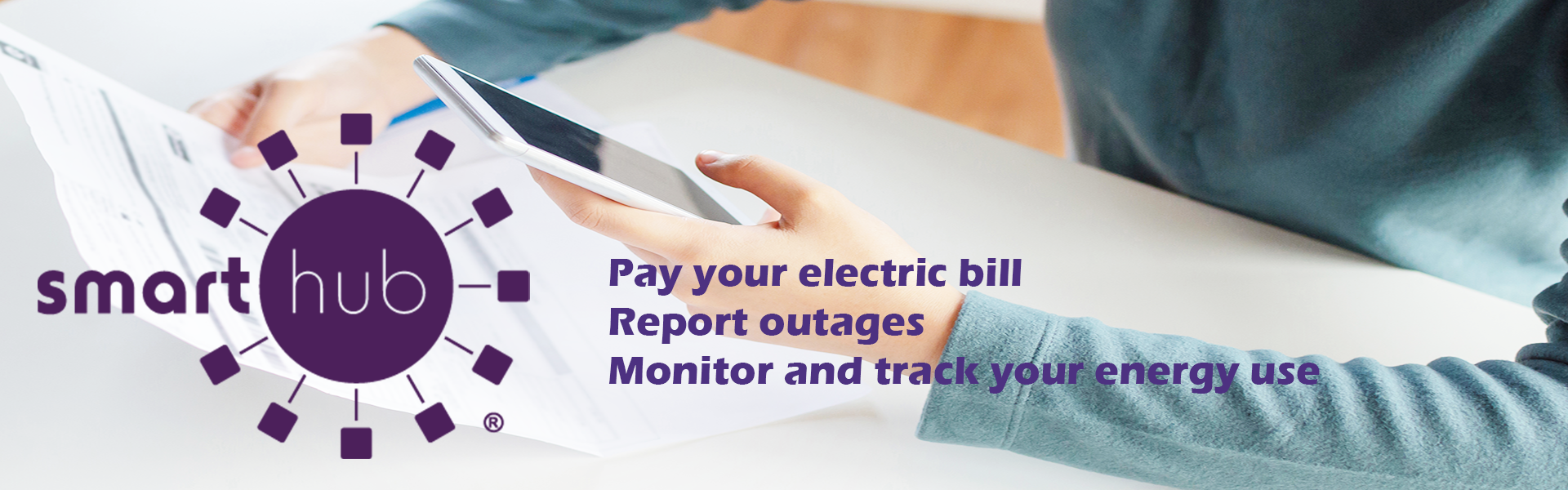 Slide containing a picture of someone using a cell phone to pay their bill that links to our SmartHub portal